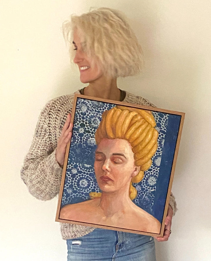 Artist holding Golden Crown painting Medusa