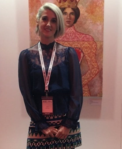 Artist Leah Mariani with Red Queen painting