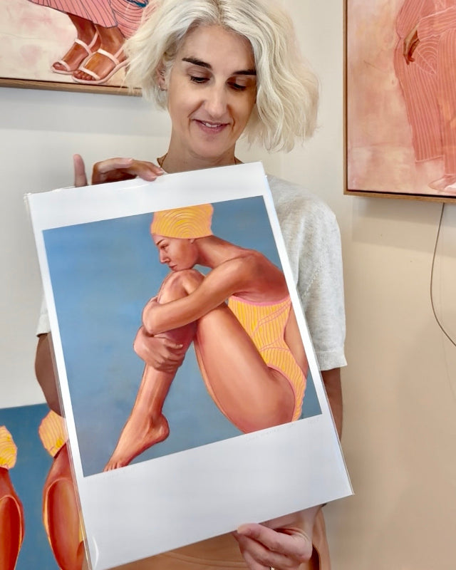 Artist holding Curve Ball print of a swimmer