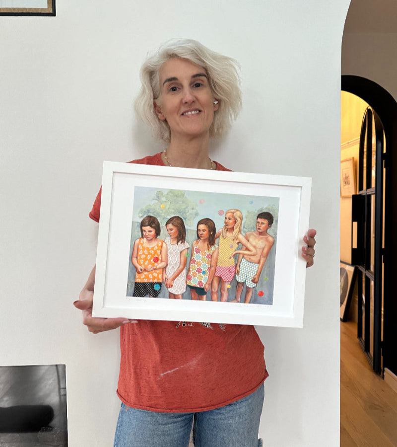 Artist holding Waiting A3 print framed