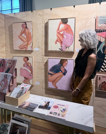 Leah Mariani artist with paintings